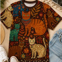 Load image into Gallery viewer, Folk Art Cat Shirt Women Graphic Tee Vintage Boho Style All Over Print Design Featuring Whimsical Cats Dancing Among Florals Warm Autumn Color Palette Orange Teal Cream Tones Lightweight Casual Wear Perfect Cat Lover Gift Idea Artistic
